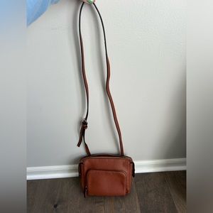 Small brown crossbody clutch bag